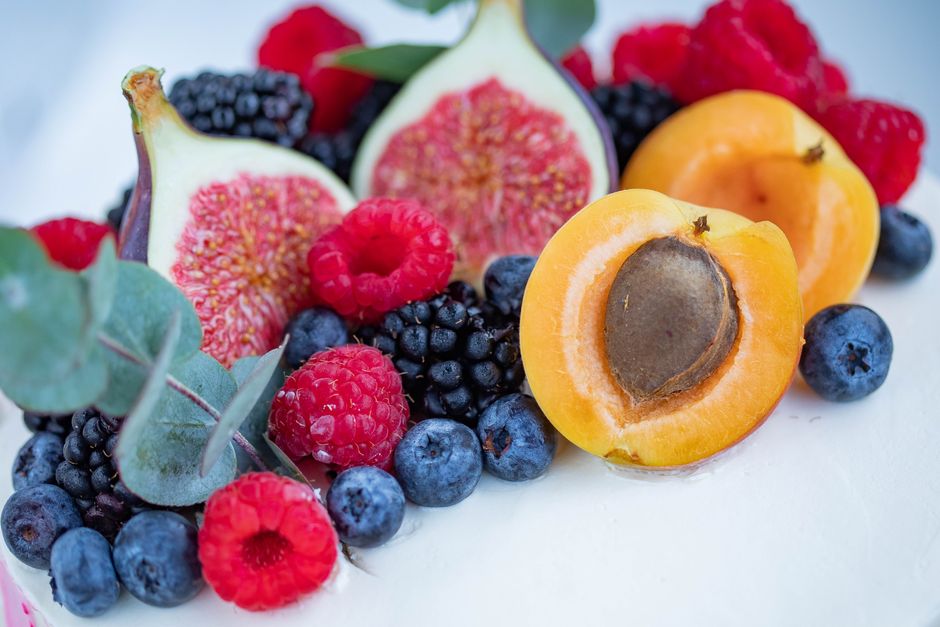 Assorted fresh fruits figs apricots and berries