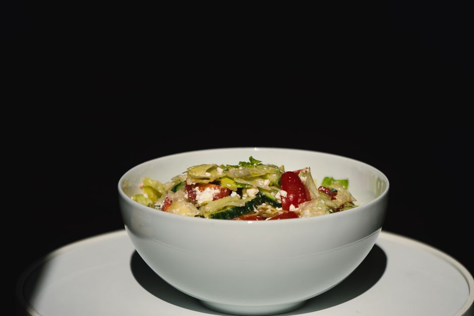 Bowl of assorted salad greens and vegetables