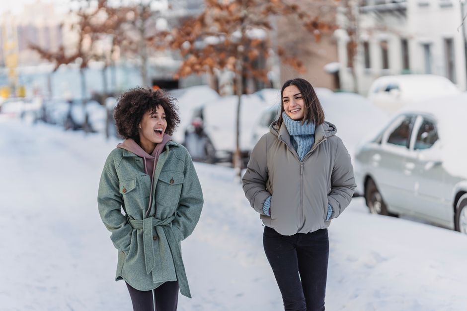 Friends walking outdoors on a snowy winter day
