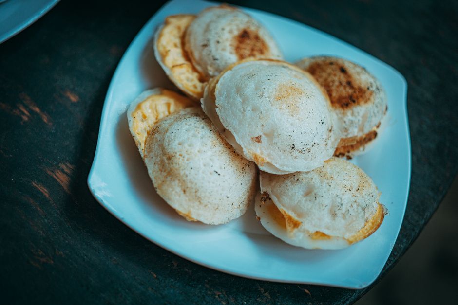A close-up view of freshly baked bread pieces on a white plate, ideal for food photography.